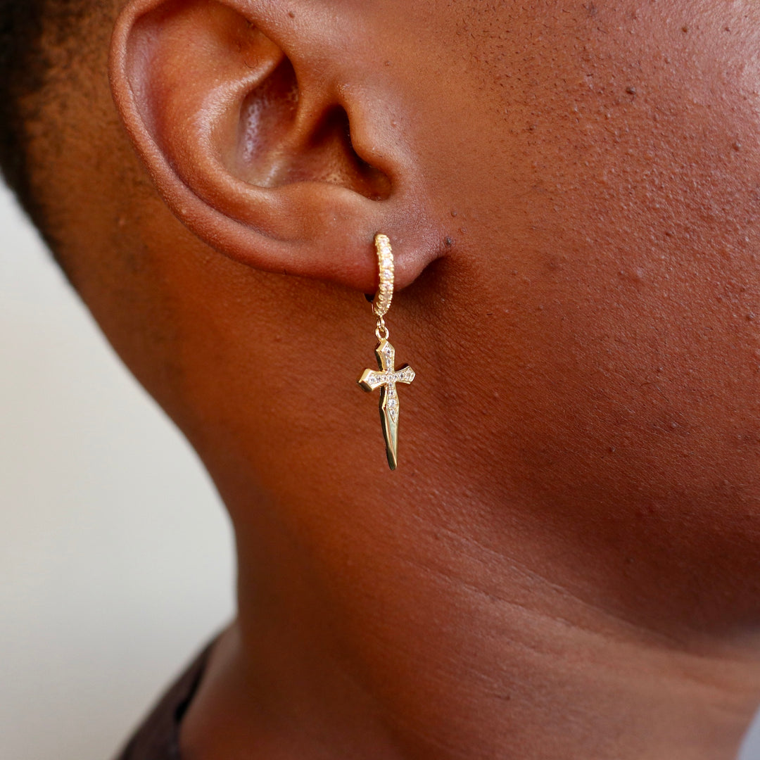 Model Wears The Hoop Cross Earrings - Yellow Gold