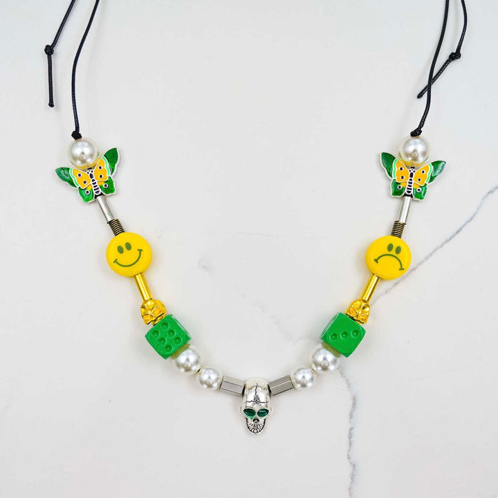 Smiley Pearl Necklace - Green Dice on White Marble