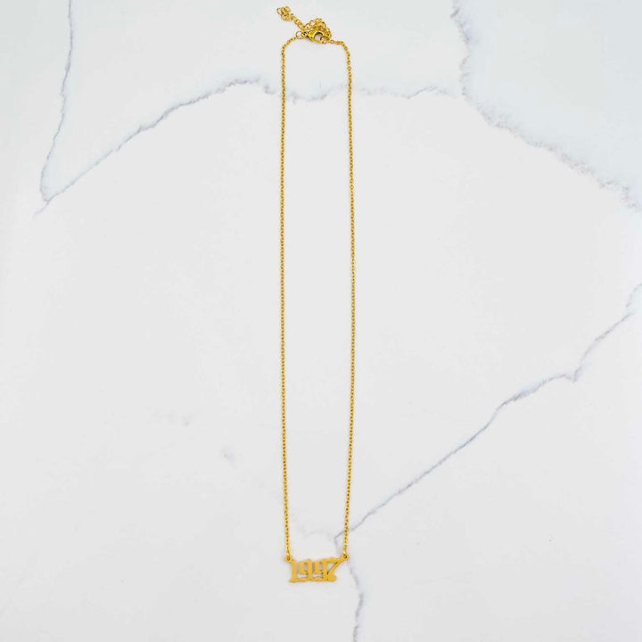 1997 Nameplate Necklace - Gold on White Marble